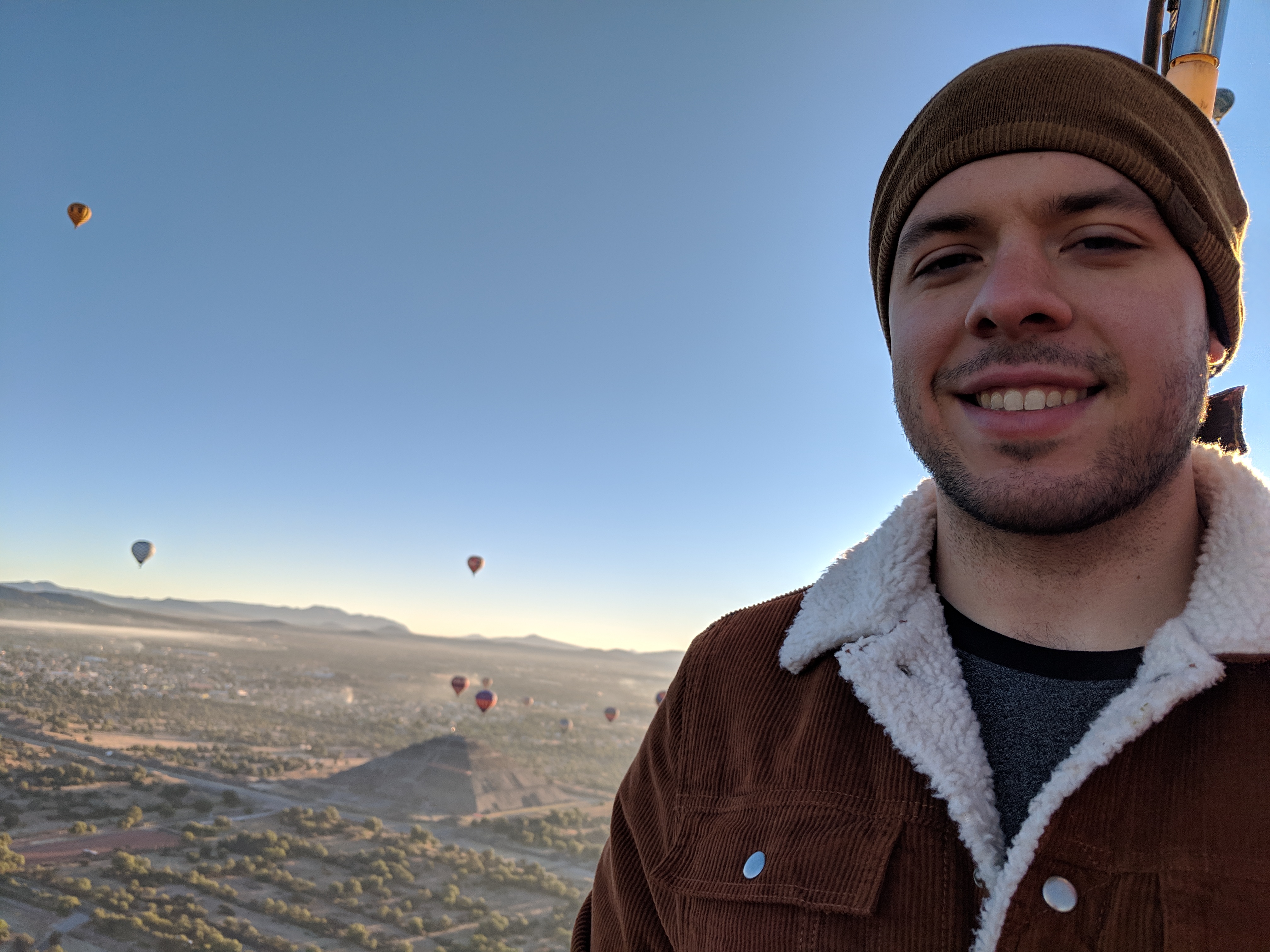 Ryan Acevedo on an air balloon smile with a beanie on